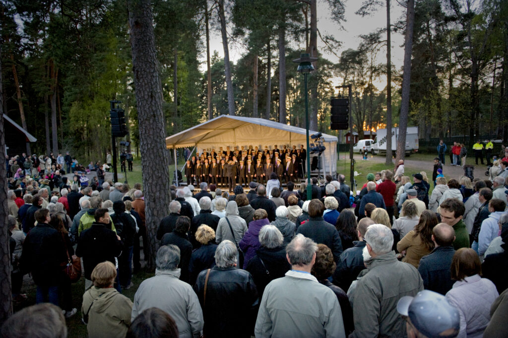 Choir singing in front of a crowd